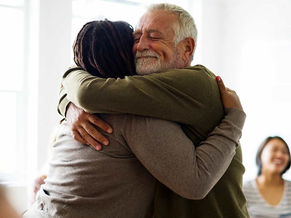 Man hugging woman