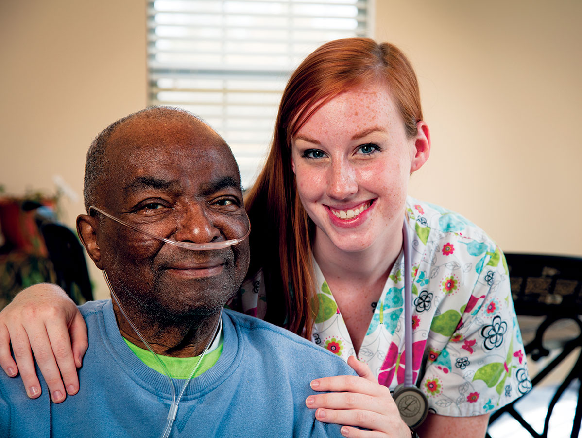 Nurse smiling with an older patient